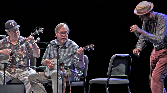 Bob Carlin and Tony Tony Trischka play banjos while Dom Flemons accompanies on the bones.
